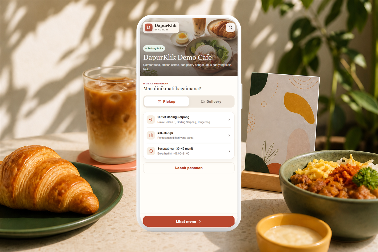 Halaman awal toko DapurKlik di tengah sajian croissant, kopi susu, dan rice bowl